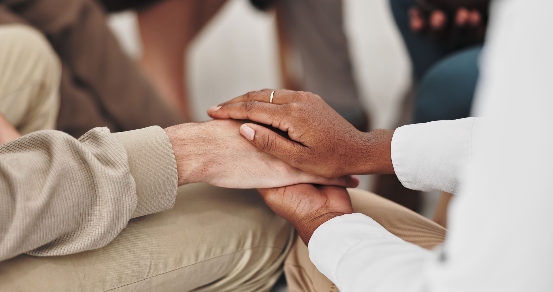People, group and therapy in community, hands and listening with advice, empathy and kindness with doctor. Mental health, trust and closeup for support, counselling and therapist in circle for help